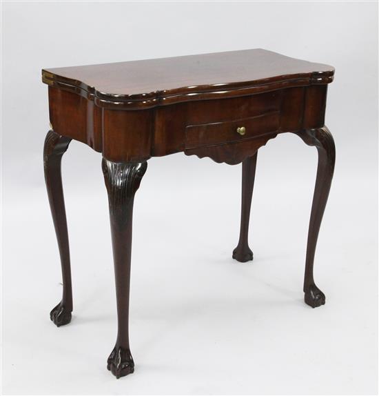 A late 18th century Dutch mahogany serpentine fronted card table, W. 2ft 6in. D. 1ft 3in. H. 2ft 6in.